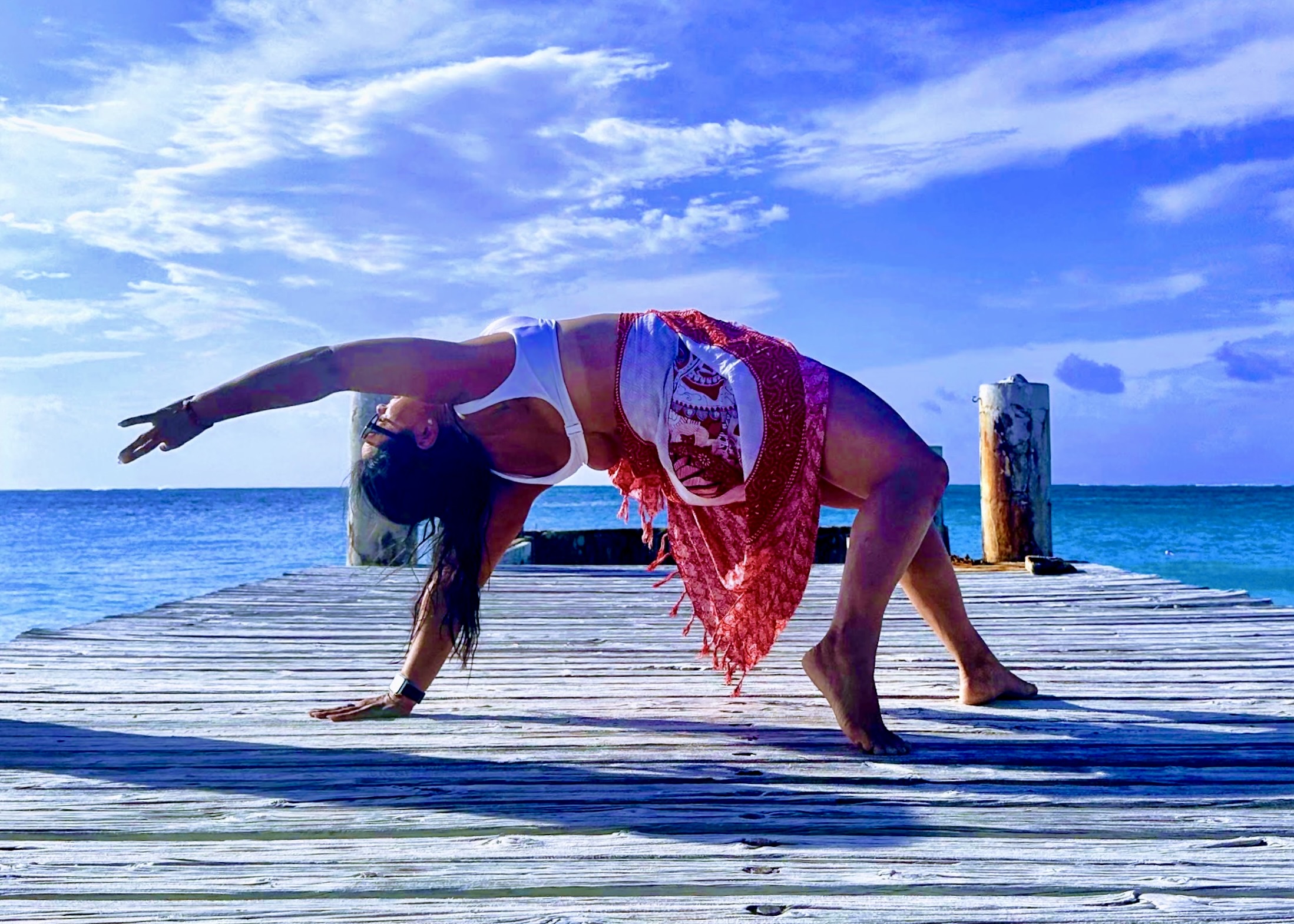 Francine in a wild-thing pose on a dock in Turks & Caicos